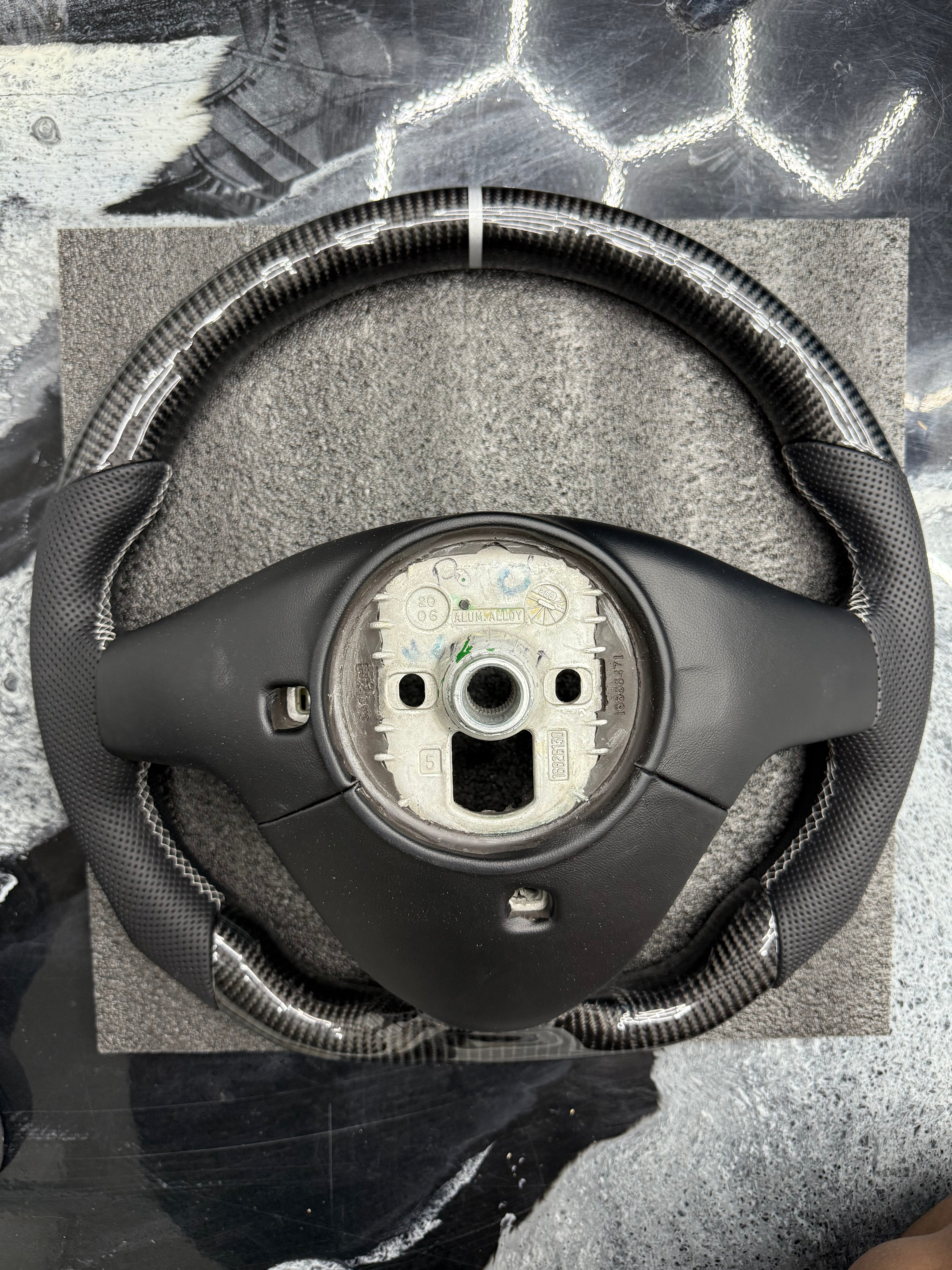2003 - 2008 CTS, CTS-V V1 Custom Carbon Fiber Steering Wheel with Perforated Leather Hand Grips / Leather Rear Cover